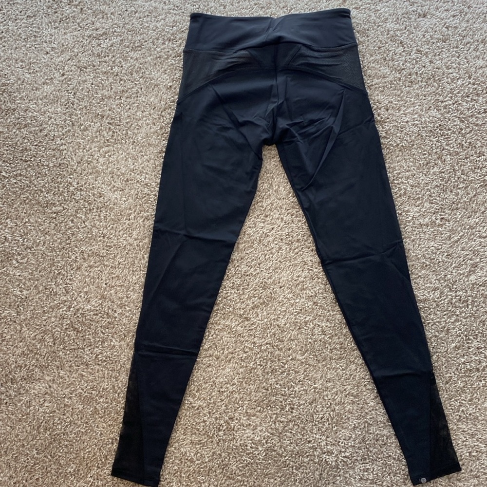 Onzie yoga Shaper Legging. 
Black shredded frontline with mesh. Midi length